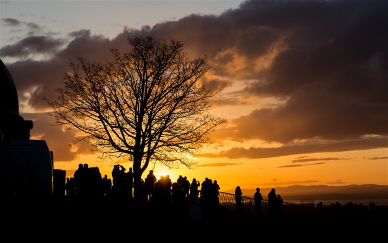 Crowds gathering at sunset on Beltane night 2015, by Neil Barton